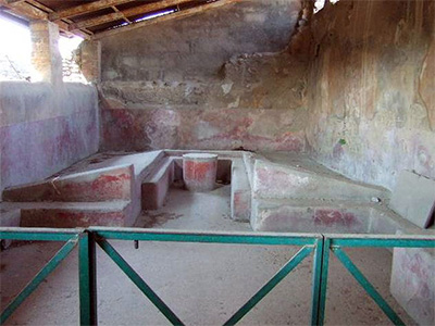 Triclinium with built-in couches. Pompeii
